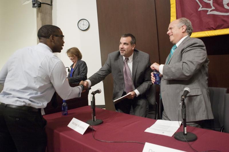 A student spoke with Michael Andolina and Darryl Bradford after their panel.