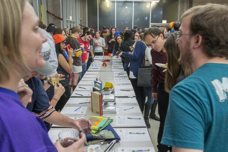 Before the live auction starts, students bid on silent auction items. 