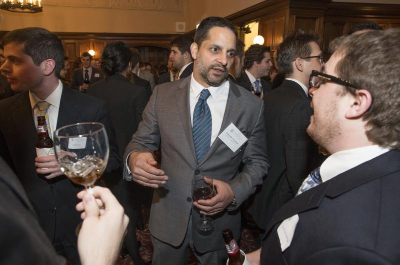 Professor Eduardo Peñalver chats before dinner. 