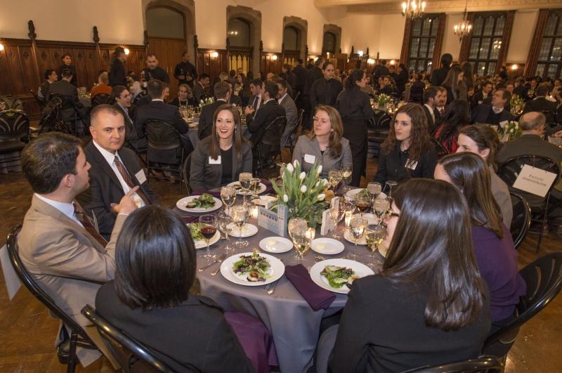 Faculty, students, and administrators break bread together. 