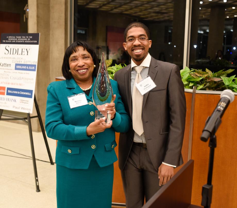 Judge Donald, holding her award, with Andre Washington.