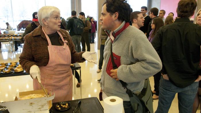 Willard takes a break from slicing and serving at the Law School's annual November pie event.