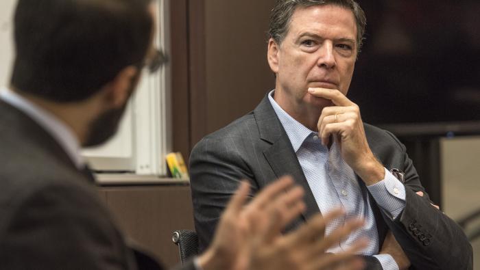 Comey (right) listens to Professor John Rappaport during the Criminal Procedure class they co-taught during Comey's two-day visit to the Law School.