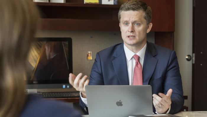 Professor Anthony Casey speaks at his desk