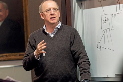 Professor Randal Picker standing in front of whiteboard.