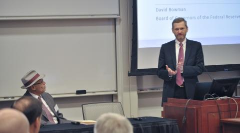 Richard Sandor looks on as Law School Dean Thomas J. Miles delivers introductory remarks.