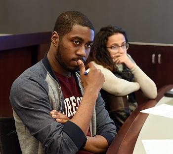 Law School students Darrius Atkins, '19, and Amanda Johnson, 18, listen in a small-group session.