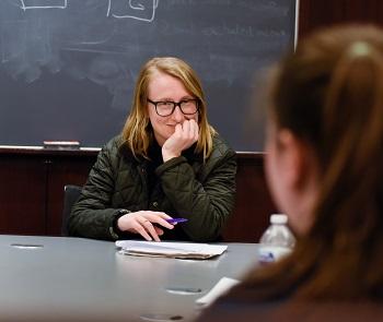 Law student Piper Pehrson, '18, listens to a student.