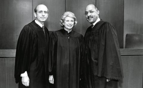 Stephen Breyer, Sandra Day O’Connor, and Dennis Archer pose for the camera in judges robes
