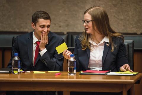 Tate Wines and Abigail Majane seated at a table