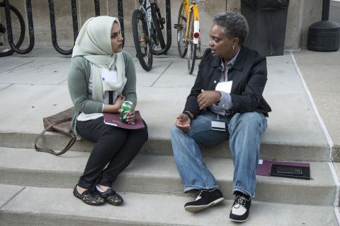 Law School student and Lightfoot chat outside.