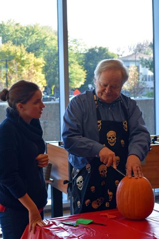 Badger carving a pumpkin