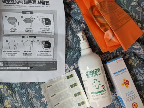 When she arrived in Seoul, Kim was sent a quarantine care package that included hand sanitizer, disinfecting spray, disposable thermometers, and (not depicted) face masks.