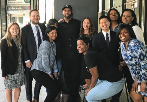 Client David Cousins poses with his family and his FCJC team outside the Dirksen US Courthouse