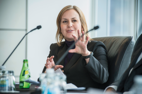 Erica Zunkel speaks at a conference table