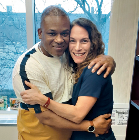 Client Leslie Mayfield and Alison Siegler embrace, posing for a photo