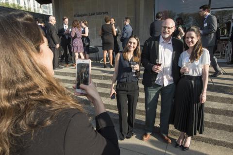 Tom Ginsburg takes photos with students