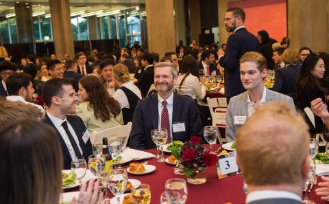 Dean Thomas J. Miles talks with students.