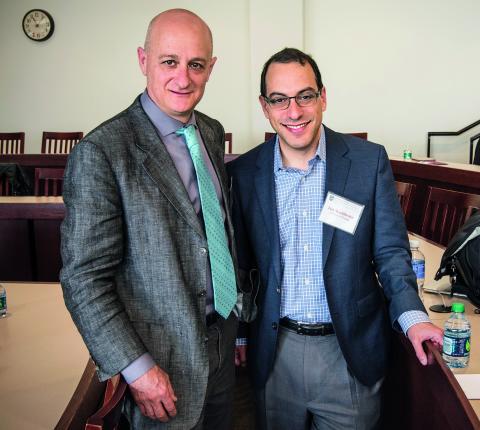 Omri Ben-Shahar and Lior Strahilevitz pose together in a Law School classroom