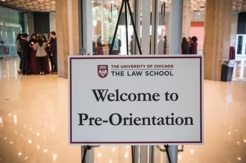 A sign declaring, "Welcome to Pre-Orientation" leans on an easel