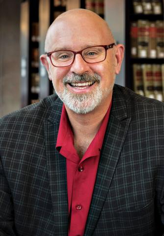 A headshot of Tom Ginsburg smiling