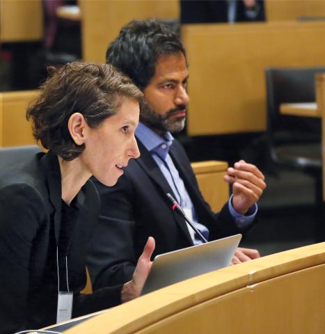 A photo of Professor Genevieve Lakier sitting leaning forward in a chair.