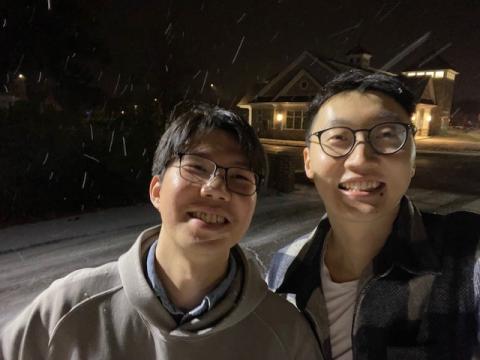 Brian Wang takes a selfie in the snow with a friend.