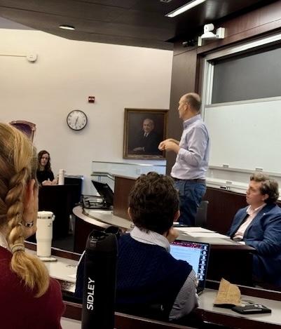 Professor Samuel Bray standing, delivering his remarks