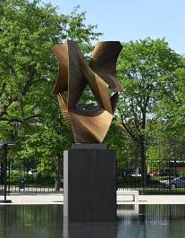 A twisting bronze statue radiating in different directions, with thin, angular planes and hyperbolic curves