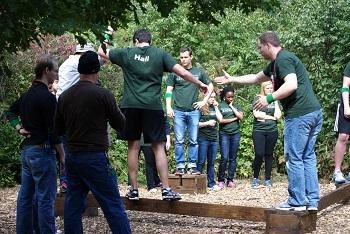Students partaking in balance-beam course