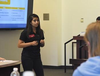 Nigam gives a presentation to students