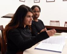 Lab student Dania Baig makes a point as Law School student Mary Johnson, '18, looks on.
