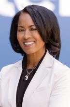 April Miller Boise wearing white suit