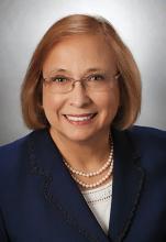 Judith Boggs wearing dark blue/black suit