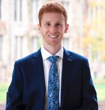 Portrait of a man wearing a suit and smiling
