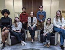 Erica Zunkel and her students seated together to pose for a photo.