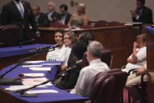 Clinic Director Beth Kregor testifies at a city council meeting