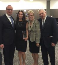 Alison Siegler, second from left, poses with three other people at the award ceremony