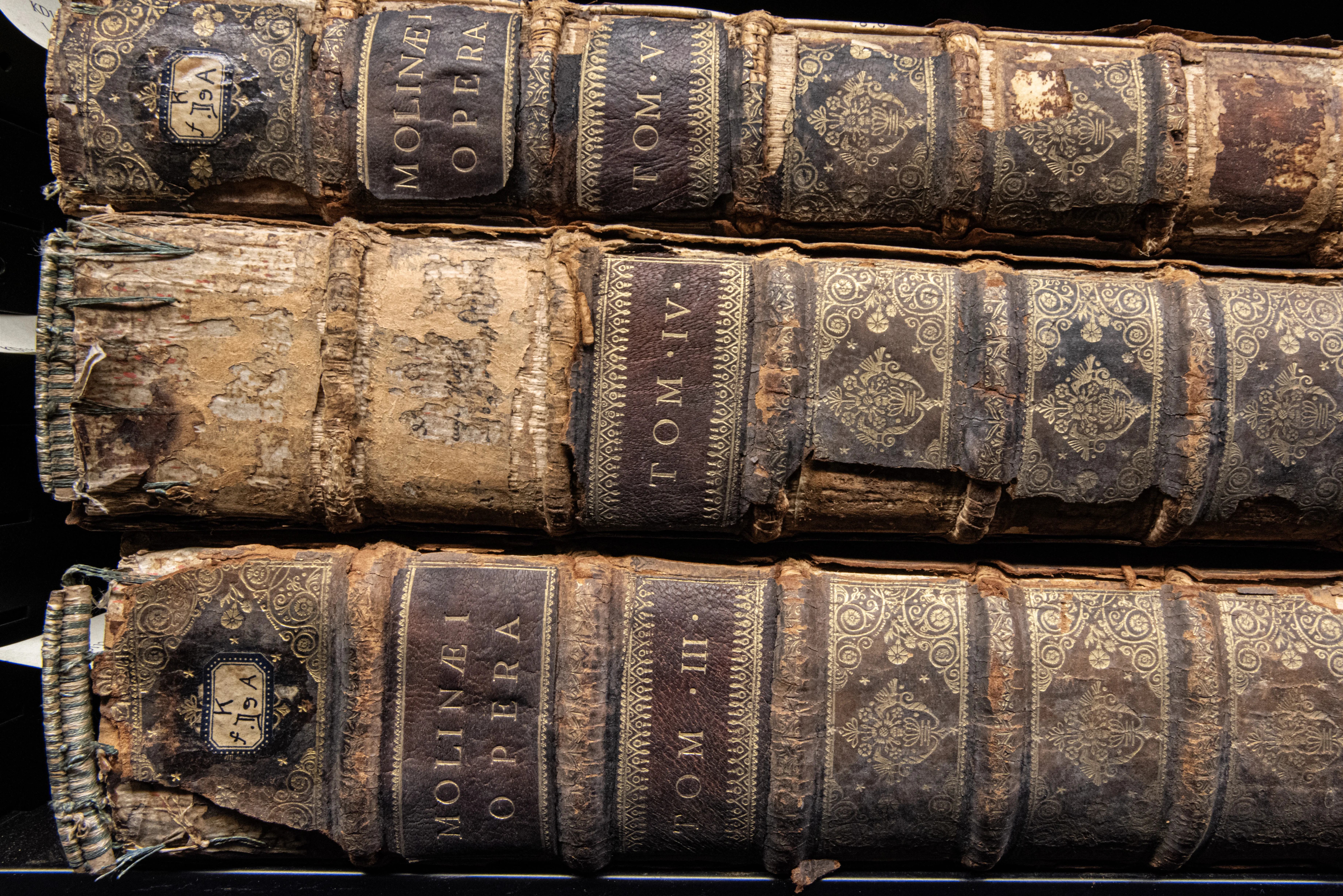 A stack of 3 books with different volume numbers.