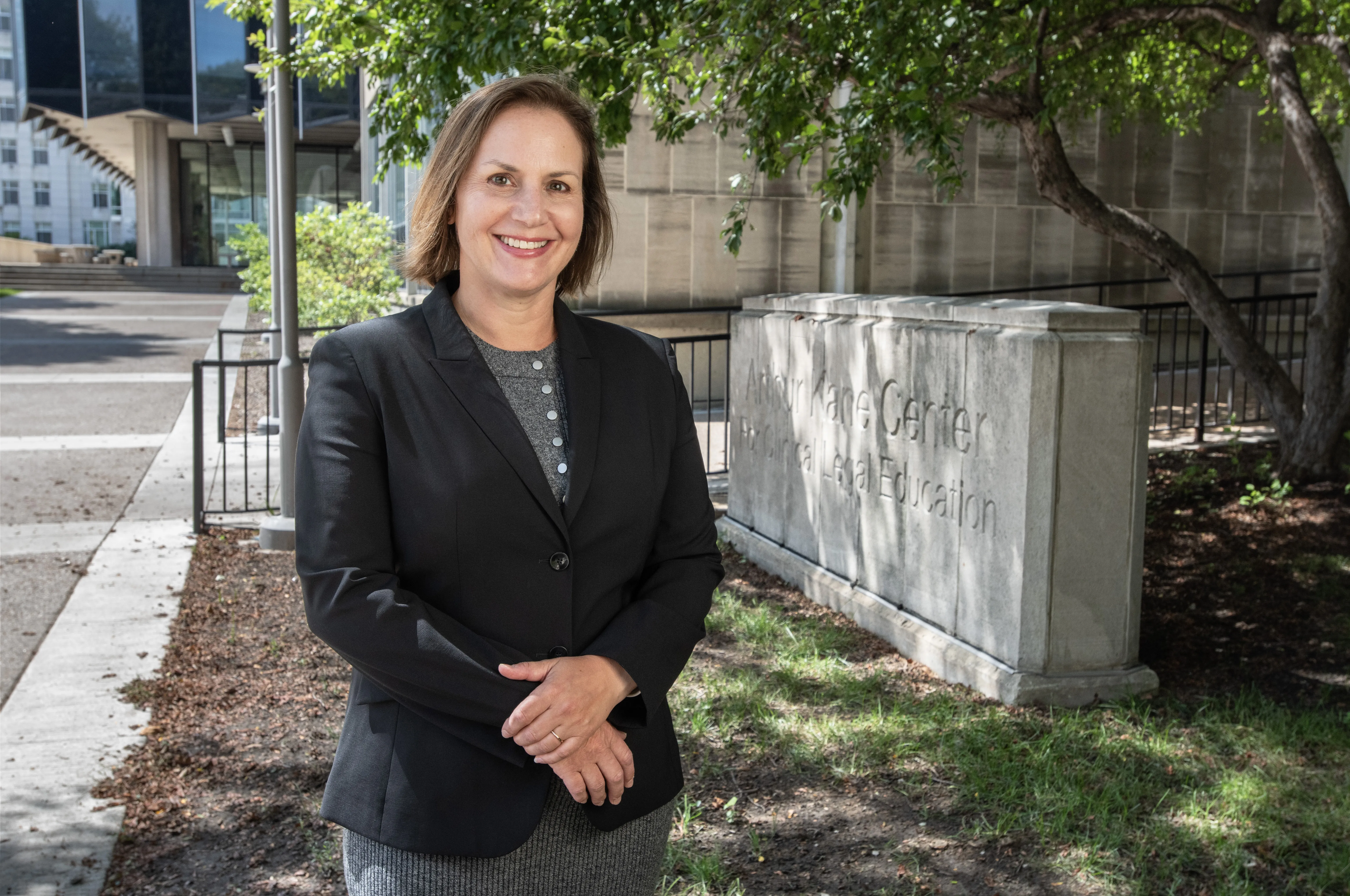 Erica Zunkel in front of clinics building