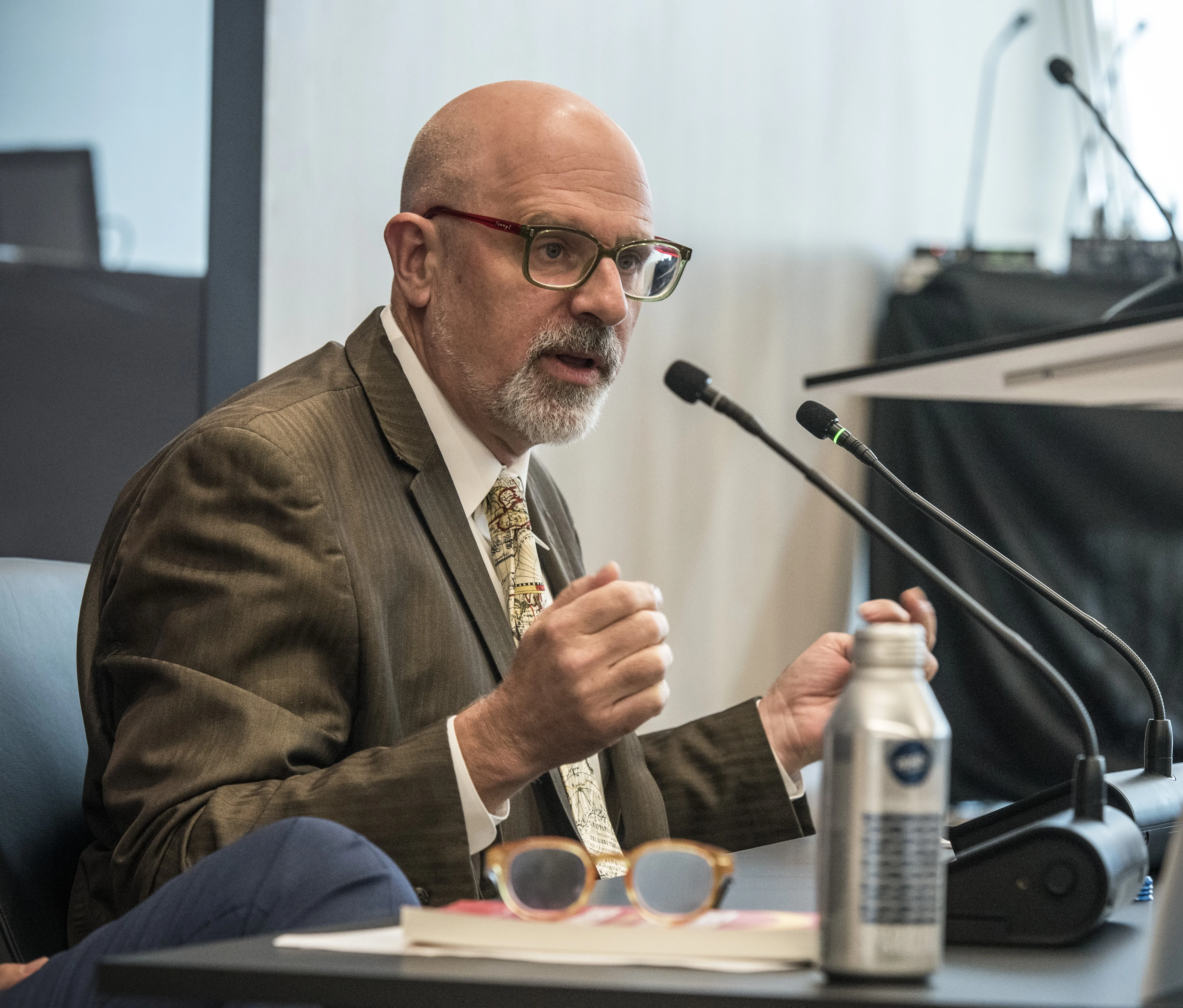 Tom Ginsburg speaking into mic