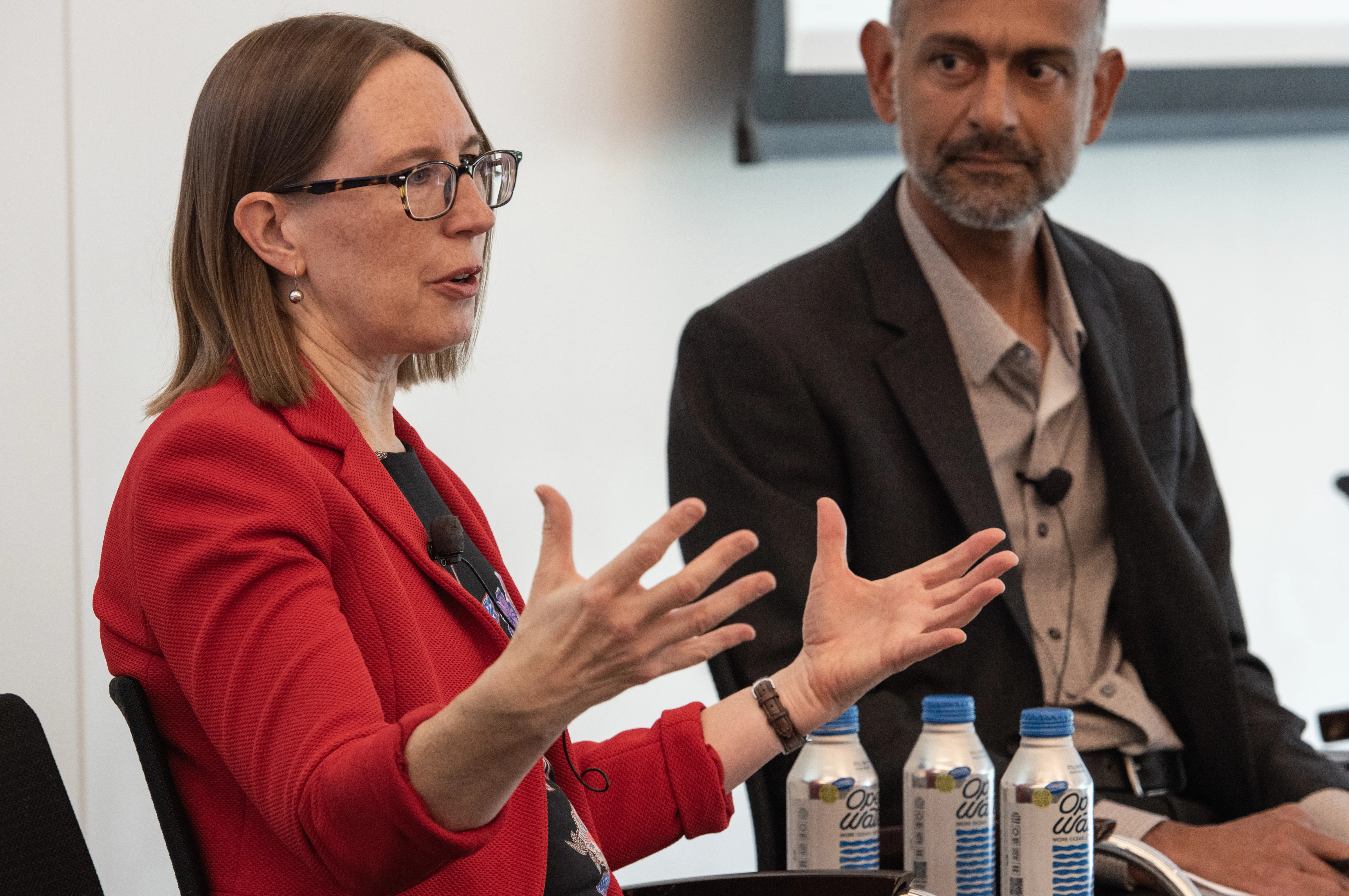 A photo of SEC Commissioner Hester Peirce and Grewal.