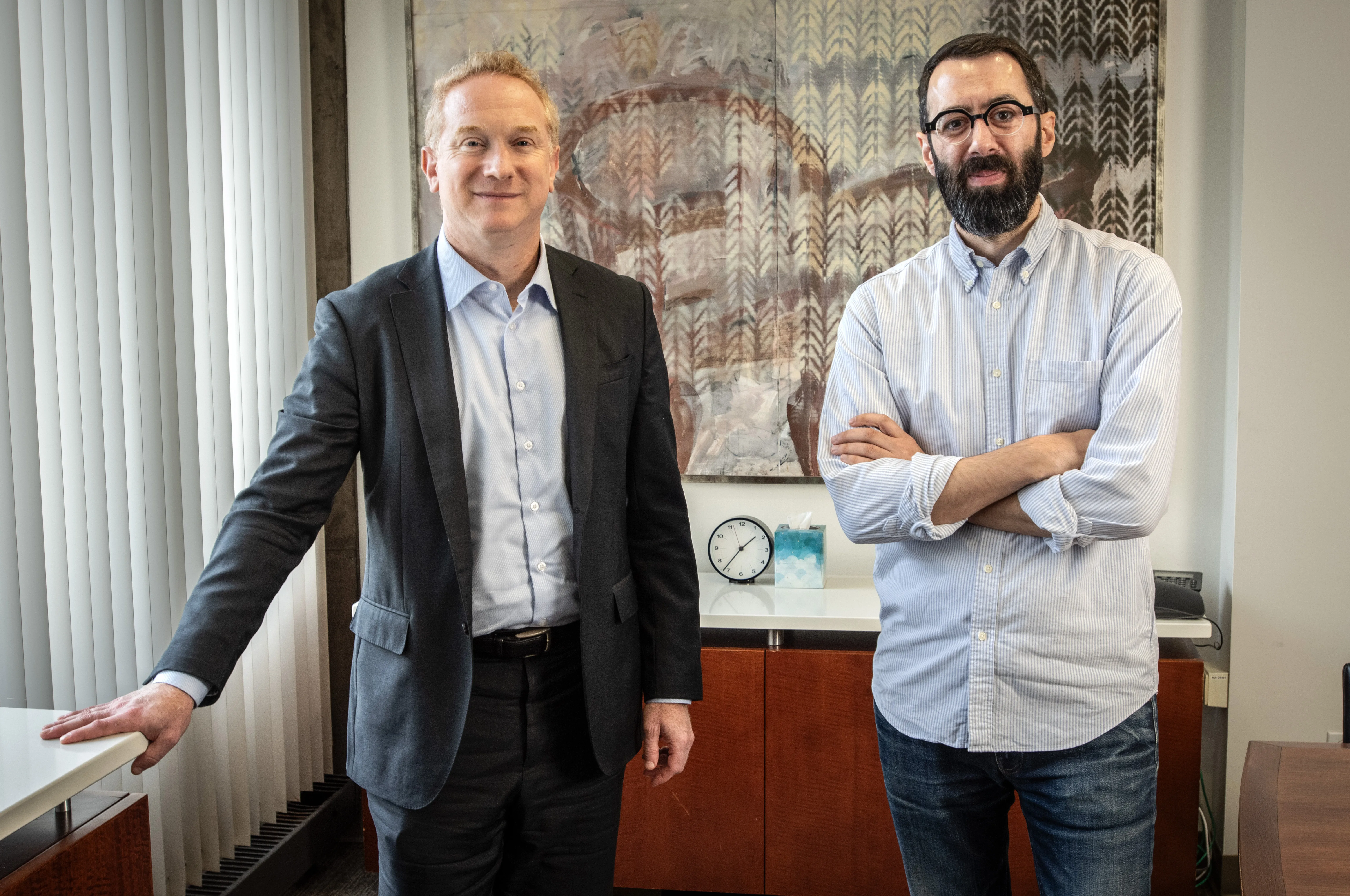 Professors Masur and Rappaport stand side by side in a conference room