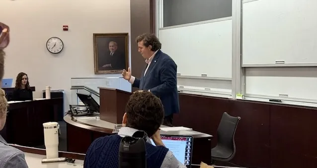 Will Baude standing at lecturn, speaking