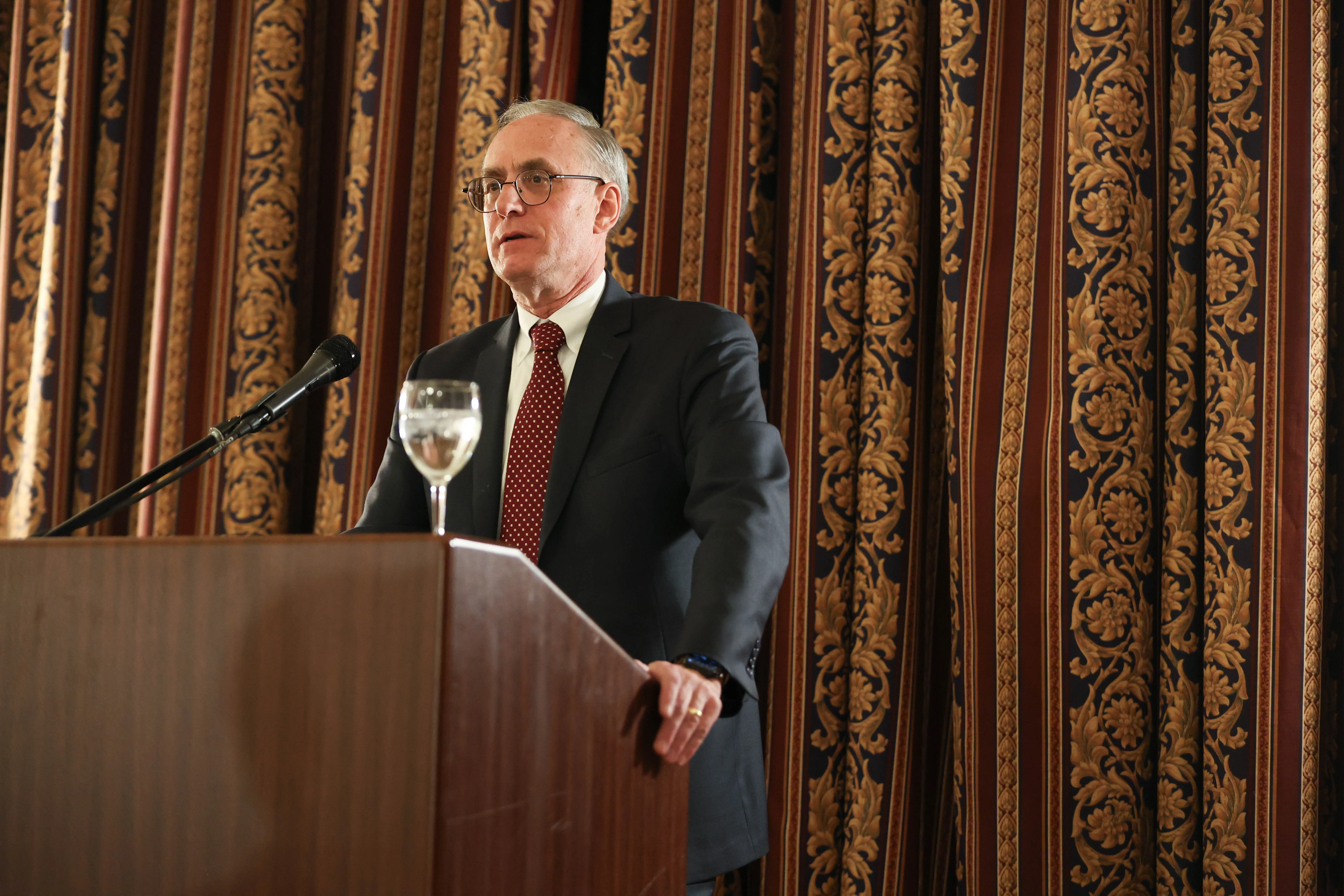 Professor Curtis Bradley speaks at the podium.